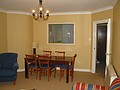 Kitchen window and a table in the living room