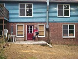 In the back of Michael's house with backpack