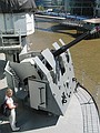 Kids behind antiaircraft gun